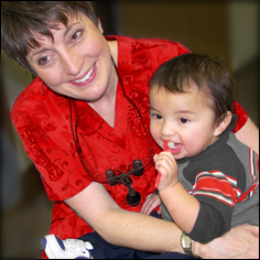 Oral health care worker with child